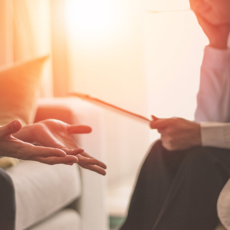 two people sat talking (Stock image)
