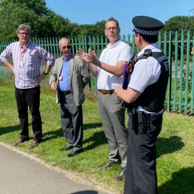 PCC John Campion outside talking with officers and councillors