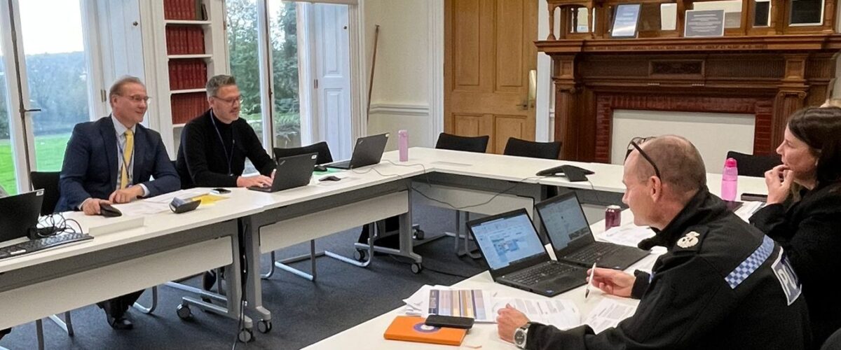 PCC John Campion and DPCC Marc Bayliss sat at a table opposite Chief Constable Pippa Mills and Deputy Chief Constable Alex Murray