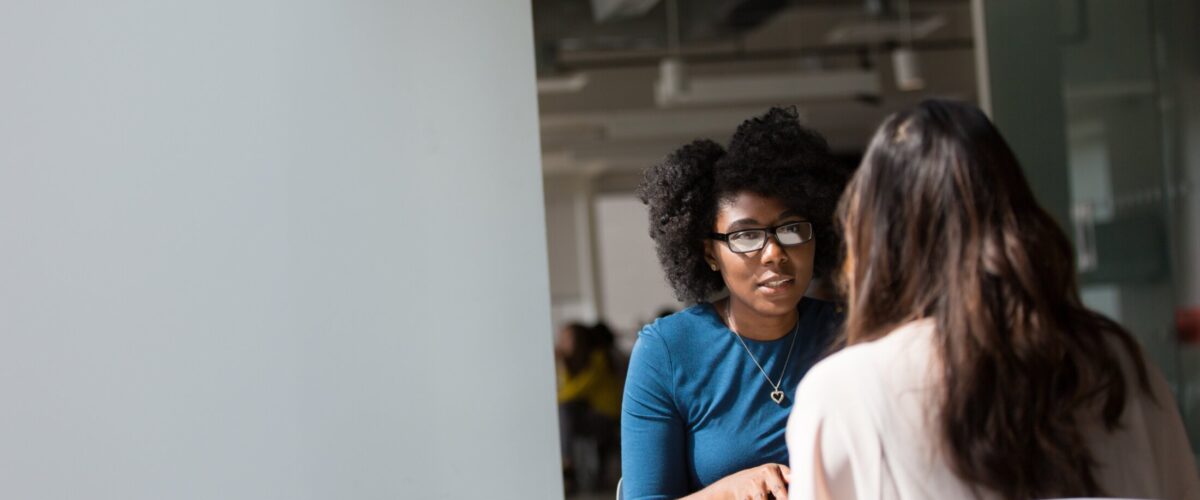 Two people talking in a 1 to 1 session