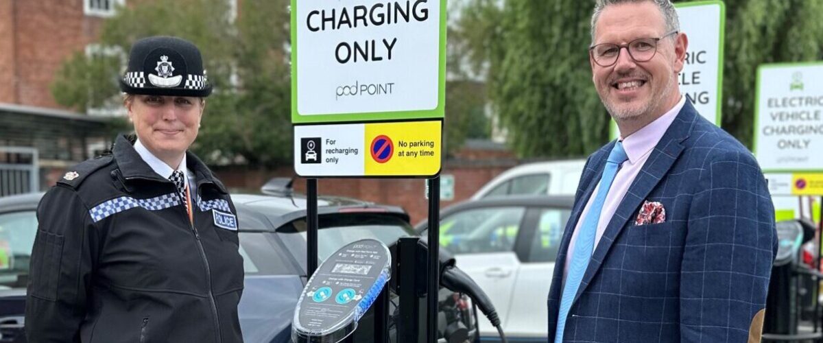 PCC John Campion with Superintendent Rebecca Love stood by electric vehicle charging point at Worcester Police Station